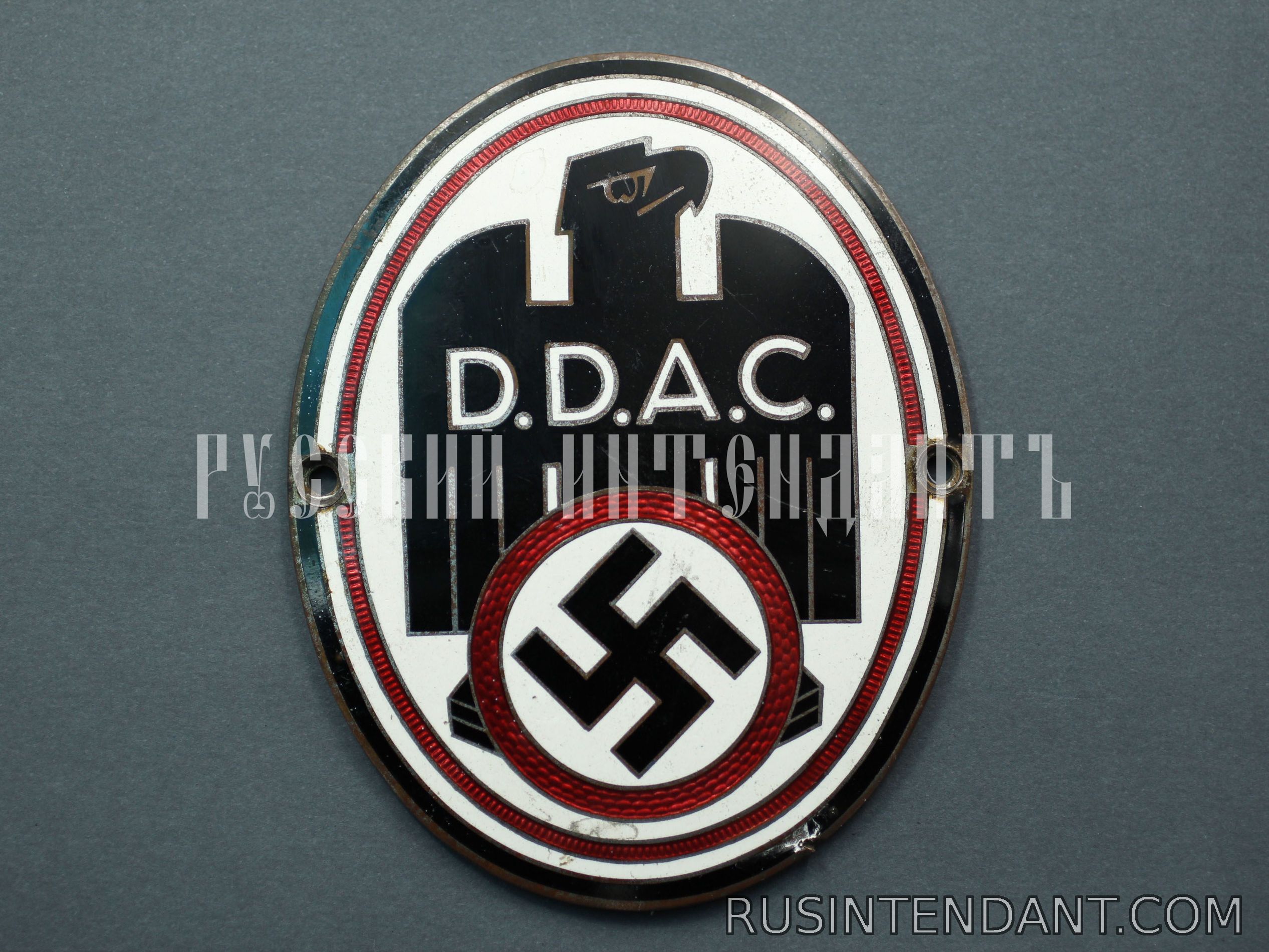 Фото 1: Эмблема D.D.A.C. 